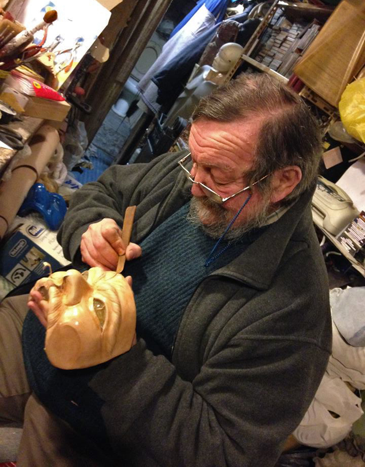 Carlo Setti in his workshop working on a leather mask for actors of the Commedia dell'Arte