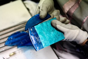 Breaking the glass and gold tiles for mosaics