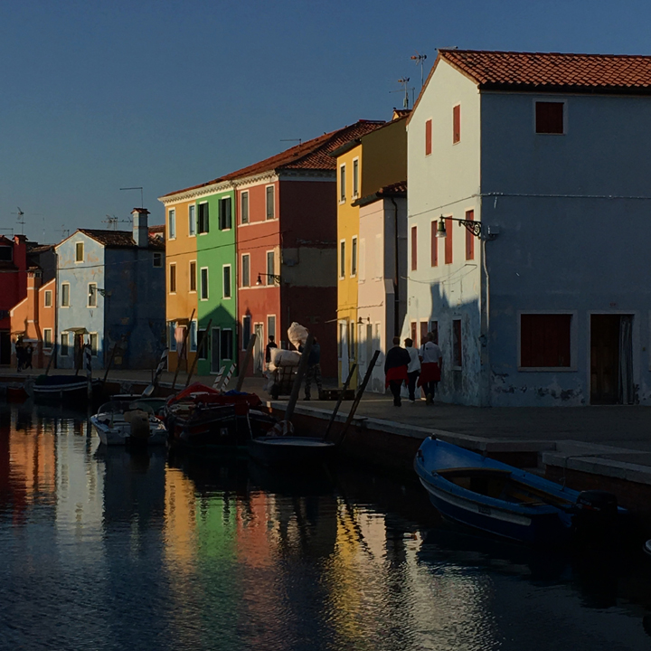 The island of Burano by sunset with its colorful houses