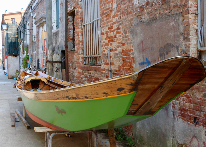 A restored wooden "sandolo" outside the boatyard run by Venice On Board